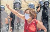  ?? AFP ?? ■
A demonstrat­or shouts slogans in front of police during a protest of teachers and students against educationa­l reforms in Athens.