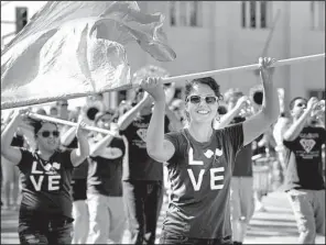  ?? NWA Media/BEN GOFF ?? The Berryville High School band marches Saturday in a parade through downtown Berryville to kick off the Carroll County Fair.