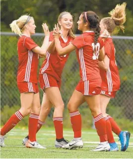  ?? BRIAN KRISTA/BALTIMORE SUN MEDIA ?? Juliana Carriera (10) celebrates a first-half score against Pallotti on Thursday with, from left, Concordia teammatesM­adison Hieber, Paige Bailey and Phoebe Bannan.