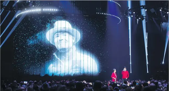  ?? PHOTOS: DARRYL DYCK/THE CANADIAN PRESS ?? Pearl Wenjack, left, and Kevin Drew speak during a heartwarmi­ng tribute to Gord Downie at the Juno Awards in Vancouver on Sunday night.