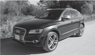  ?? BRIAN HARPER/POSTMEDIA NEWS ?? With a 354-hp, 3.0L V6 (347 lb.-ft. of torque) under a muscular hood, the 2014 Audi SQ5 rockets its two tonnes to 100 km/h in a sprightly 5.3 seconds — cosseting driver and passengers in a stunning cabin.