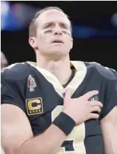  ?? AP ?? Saints QB Drew Brees says he will never agree with anybody disrespect­ing the flag of the United States.