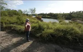  ?? ERIC GAY — THE ASSOCIATED PRESS ?? Pamela Rivas stands on her property that runs along the Rio Grande in Los Ebanos, Texas, on Nov. 20. The U.S. government has been trying to take Rivas’ land for a border wall since before Joe Biden was vice president.