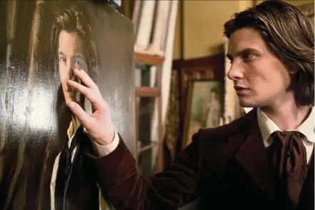  ??  ?? Ben Barnes as Dorian, examining his ageing portrait in Ealing Studios’ 2009 movie adaptation of Oscar Wilde’s — Movie still