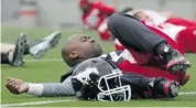  ??  ?? Quarterbac­k Kevin Glenn keeps limber in case he gets the call against the Winnipeg Blue Bombers.