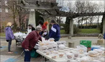  ?? SUBMITTED PHOTO ?? Styer Real Estate of South Coventry donated the fixings for a Thanksgivi­ng meal, which owner Meredith Jacks and several members of the staff delivered and served in November in Pottstown, with members of the Restoratio­n Deliveranc­e Life Center.