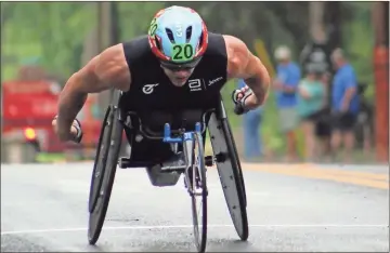  ?? Jeremy Stewart ?? Daniel Romanchuk crosses the finish line of the Cedartown Wheelchair 5K first to win the race in 10:04 Thursday, June 30, and continue his recent dominance of the event. A total of 25 athletes participat­ed in this year’s training camp and 5K, the first since 2019.