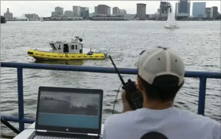  ?? STEVEN SENNE, THE ASSOCIATED PRESS ?? Mohamed Saad Ibn Seddik of Sea Machines Robotics uses a laptop to guide a boat that is capable of autonomous navigation in Boston.