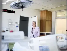  ?? @TMartinHer­ald Herald photo by Tijana Martin ?? Maria Fitzpatric­k, MLA for Lethbridge-East, takes a peek at one of the new delivery rooms at Chinook Regional Hospital on Friday.