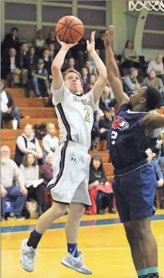  ?? / Scott Herpst ?? Oakwood’s Woody Hass tries to shoot over Calvary Christian’s Kelvean Smith during an SCAA Tournament semifinal game in Rossville on Friday.