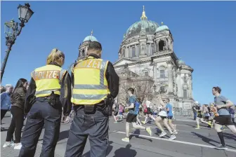  ?? DPA VIA AP ?? FOILED ATTACK: Police observe the half marathon in front of the Berlin Cathedral in Berlin yesterday.