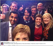  ??  ?? LOW ROAD: Watched by party faithful, Nicola nudges into a selfie