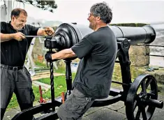  ??  ?? Adjustment­s to a cannon captured at Sebastopol in 1856 and installed on Berwick’s walls