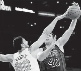  ?? Luis Sinco Los Angeles Times ?? ENES KANTER of the Knicks blocks a shot by Lakers center Ivaca Zubac in the second quarter Friday night at Staples Center. Zubac had 10 points in 11 minutes.