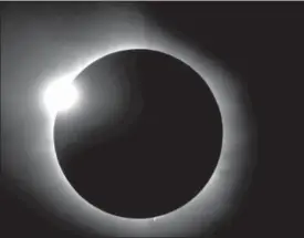  ?? R. BAER, S. KOVAC — CITIZEN CATE EXPERIMENT VIA AP ?? A “diamond ring” shape during the 2016 total solar eclipse in Indonesia is shown. For the 2017 eclipse over the United States, the National Science Foundation-funded movie project nicknamed Citizen CATE will have more than 200 volunteers trained and...