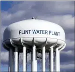  ?? ASSOCIATED PRESS FILE PHOTO ?? The Flint Water Plant water tower is pictured.