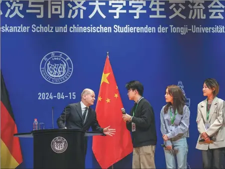  ?? MICHAEL KAPPELER / AP ?? German Chancellor Olaf Scholz, who is on a three-day official visit to China starting on Sunday, attends an exchange event with students at Tongji University in Shanghai on Monday.