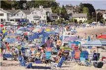  ?? Brian A. Pounds/Hearst Connecticu­t Media Group ?? Compo Beach is packed for the annual fireworks in Westport on June 30, 2022. A bill under considerat­ion in the state legislatur­e would cap what towns like Westport can charge
non-residents to access beaches.