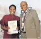  ??  ?? CHANGING LIVES: Eskom Developmen­t Foundation CEO Cecil Ramonotsi, right, congratula­tes Balisa Ntloko of Ikamva Youth