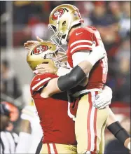  ?? Ezra Shaw / Getty Images ?? Jimmy Garoppolo, right, reacts to a touchdown by Raheem Mostert against the Packers during the second half of the NFC Championsh­ip game on Sunday.