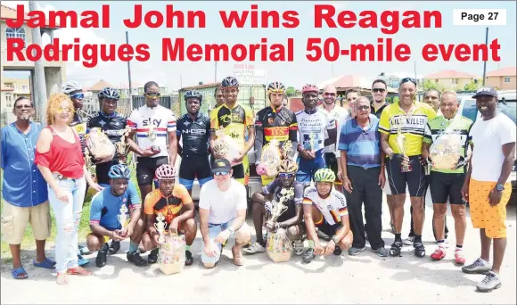  ?? (Orlando Charles photo) ?? Winners and runners-up of the 14th annual Reagan Rodrigues Memorial 50-mile road race pose with their spoils upon completion of yesterday’s event which was staged at West Demerara.
