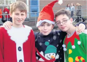  ??  ?? William Floyd-Simpson, Regan Whittaker and Rico Moragues of Rhyddings school show off their festive outfits