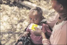 ?? LOANED PHOTO BY THE WORLD FOOD PROGRAM THIS PICTURE MADE AVAILABLE BY THE WORLD
FOOD PROGRAM ON TUESDAY, ?? shows a mother giving supplement­ary nutrition products to her 6 month old daughter in Ankilimano­ndro, Atsimo-Andrefana Region, Madagascar.