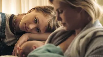  ?? FOCUS FEATURES ?? Mackenzie Davis, left, and Charlize Theron star in Tully, which takes a hard look at motherhood.