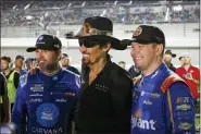  ?? TERRY RENNA - AP ?? Former NASCAR driver Richard Petty, center, poses for a photo with Jimmie Johnson, left, and Erik Jones, right, before the first of two qualifying auto races for the NASCAR Daytona 500 at Daytona Internatio­nal Speedway, Thursday, Feb. 16, in Daytona Beach, Fla.