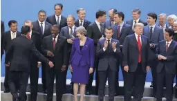  ?? AP ?? World leaders have a laugh as they gather for a group photo at the start of the G20 summit in Buenos Aires, Argentina, last Friday. From right, front row, are Japan’s Prime Minister Shinzo Abe, US President Donald Trump, France’s President Emmanuel Macron, Britain’s Prime Minister Theresa May, South Africa’s President Cyril Ramaphosa, Turkey’s President Recep Tayyip Erdogan and Indonesia’s Vice-president Jusuf Kalla. Behind, from left, are Jamaica’s Prime Minister Andrew Holness, European Council’s President Donald Tusk, the Netherland­s’ Prime Minister Mark Rutte, Spain’s Prime Minister Pedro Sanchez, Canada’s Prime Minister Justin Trudeau, Internatio­nal Monetary Fund Managing Director Christine Lagarde, and India’s Prime Minister Narendra Modi.