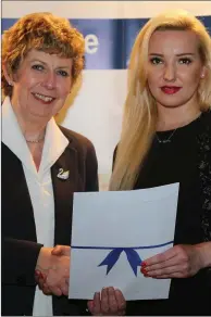  ??  ?? Jolanta Pilqiczya Rittana receiving her certificat­ion in IT from Ellen Gunning of the Irish Academy of PR. Right: Health care graduates Deirdre Cronin,Cecilstown; Margaret Buckley, Banteer and Eileen Corkery from Millstreet.