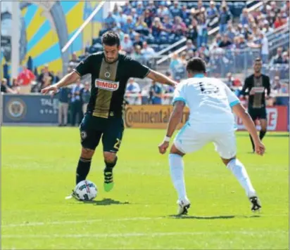 ?? MICHAEL REEVES — FOR DIGITAL FIRST MEDIA ?? Union midfielder Ilsinho, left, eyes up a shot under the pressure of Ilsinho assisted on the first goal of a 2-0 win over the Sounders. Seattle defender Tony Alfaro Sunday.