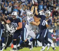  ?? (Reuters) ?? THE TENNESSEE TITANS ended an 11-game losing streak to the Indianapol­is Colts on Monday night with a big pass and a big defensive play. Marcus Mariota (8) threw a tie-breaking 53-yard touchdown strike to rookie Taywan Taylor with 5:29 left in the game,...