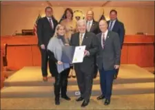  ??  ?? Delaware County Council Chairman Mario J. Civera Jr., center, presents a resolution to Patti Bruno, left, and Bill Dean, right, members of the Delaware County Day of Prayer Task Force, announcing that the 2017 Day of Prayer event will be held at 11:30...