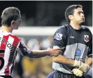  ??  ?? PAINFUL Gordon is in agony after clash with Defoe in 2009