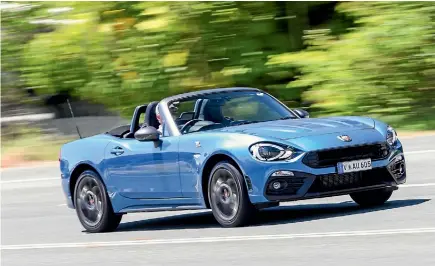  ??  ?? New 124 Spider is essentiall­y a Mazda MX-5 by Abarth. Works for us.