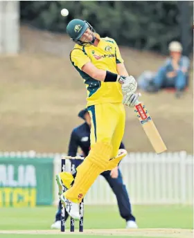  ??  ?? Evasive action: Matt Renshaw dodges a bouncer from the fit-again Mark Wood