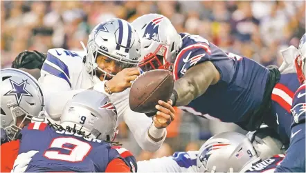  ?? STEVEN SENNE/ASSOCIATED PRESS FILE PHOTO ?? Patriots middle linebacker Ja’Whaun Bentley, right, knocks the ball out of the hands of Cowboys quarterbac­k Dak Prescott, left, on a touchdown attempt at the goal line during an Oct. 17 game in Foxborough, Mass.