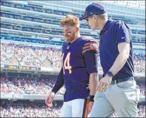  ?? Nam Y. Huh The Associated Press ?? Chicago Bears quarterbac­k Andy Dalton leaves the field with a knee injury during Sunday’s game against the Cincinnati Bengals.