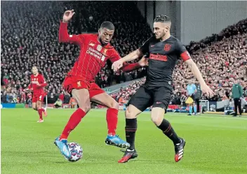  ?? Picture: PA IMAGES VIA GETTY IMAGES/PETER BYRNE ?? SECOND WIND: Atletico Madrid’s Koke, right, battles for the ball with Liverpool’s Georginio Wijnaldum during a UEFA Champions League clash in March. Koke says Atleti is hungry for Europe’s biggest prize, the Champions League cup, which is in sight.