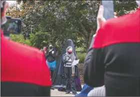  ??  ?? Fans dressed in Starfleet uniforms and other Star Trek costumes wait for the unveiling of the Captain Janeway monument.