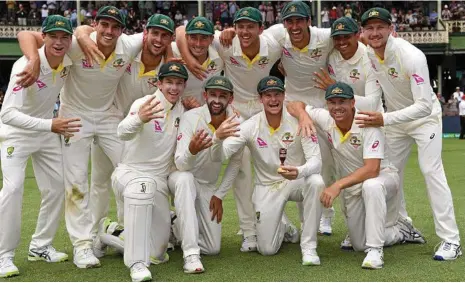  ??  ?? FOUR-SOME EFFORT: Australian players celebrate after their win in the fifth Ashes Test. PHOTO: WILLIAM WEST