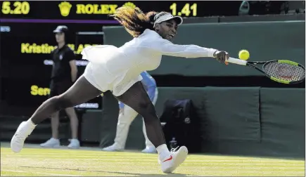  ?? Ben Curtis ?? The Associated Press U.S. tennis star Serena Williams stretches for a return against France’s Kristina Mladenovic during their Wimbledon women’s singles match on Friday in London. Williams is competing in her second major tournament since having a...