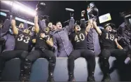  ?? Matt Rourke / Associated Press ?? Army players celebrate their win over Navy on Saturday in Philadelph­ia.