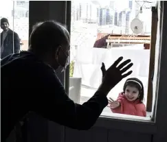  ?? ?? ABOVE: Muzaffer Kayasan, who was treated for leukemia, talks to his granddaugh­ter in Istanbul, Turkey, on 5 February 2022. He has tested positive for Covid-19 78 times.