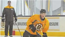  ?? StaFF FILE PHOtO By PatrICK WHIttEMOrE ?? TALENT BLOSSOMS: Bruins winger Brad Marchand practices under the watchful eye of former coach Claude Julien back in December 2016.