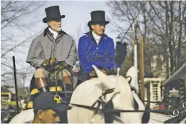  ?? BY LUKE CHRISTOPHE­R ?? High Meadow’s Matt Neiswanger, left, gave Santa a spiffy ride at this month’s Christmas parade.