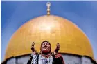  ?? ?? A Muslim woman prays on the last Friday of Ramadan in front of the Dome of the Rock, in the compound known to Muslims as Noble Sanctuary and to Jews as Temple Mount, in Jerusalem's Old City. (Reuters)