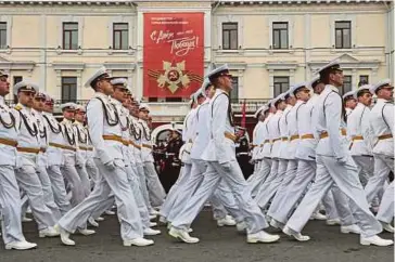  ?? REUTERS PIC ?? Russian service members marching in columns during a military parade on Victory Day, which marks the 79th anniversar­y of the Soviet Union’s victory over Nazi Germany in World War 2, in Vladivosto­k, Russia, yesterday.