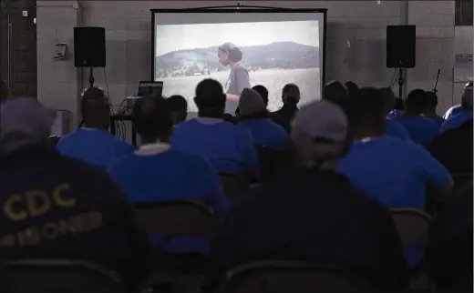  ?? JAE C. HONG/AP FILE PHOTOS 2022 ?? Valley State prisoners watch a personal documentar­y, “The Death of My Two Fathers,” by director Sol Guy on Nov. 4 in Chowchilla, Calif. A comprehens­ive review of in-prison education found that prisoners who participat­e in any kind of courses while behind bars are less likely to return to prison.